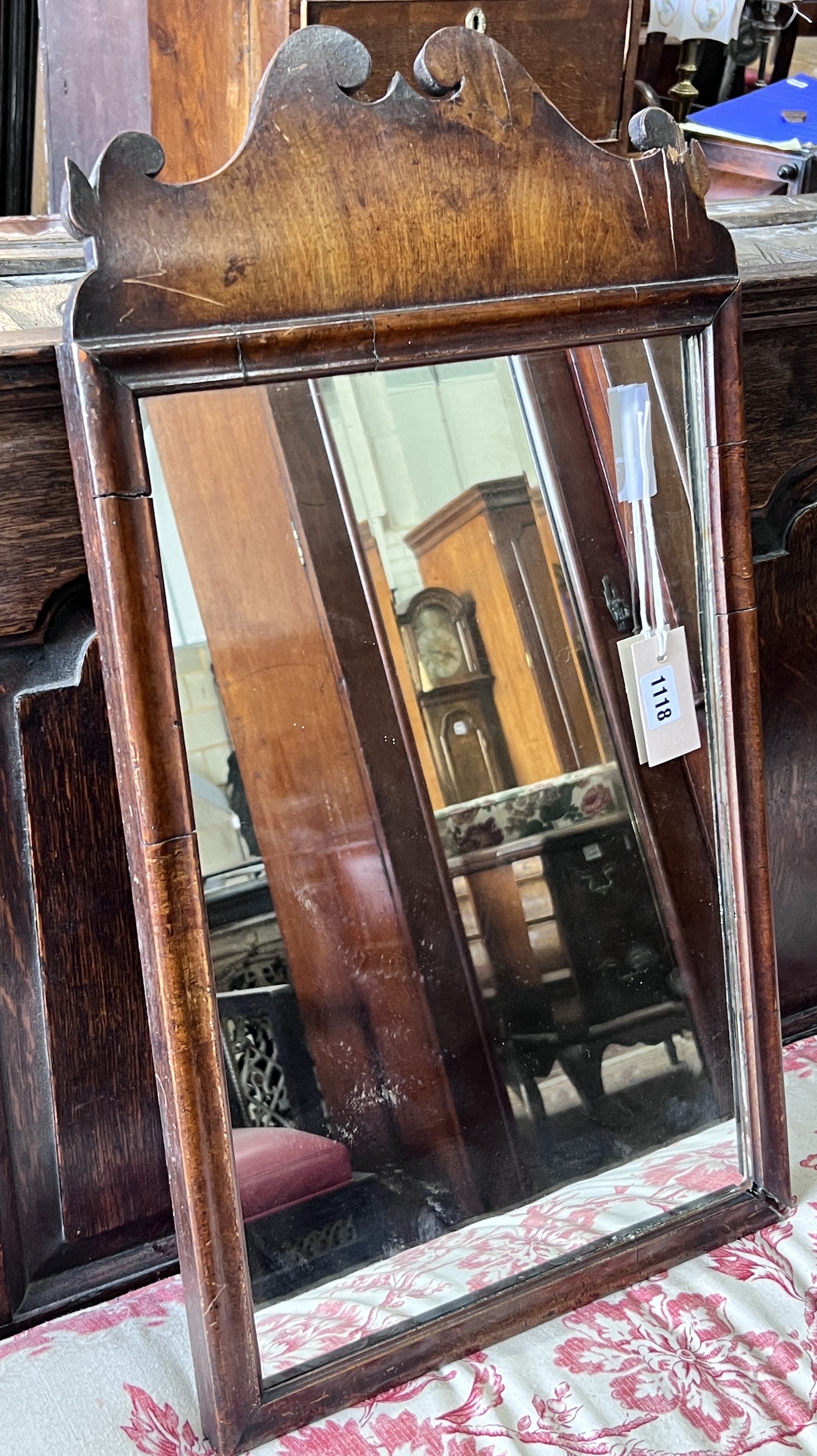 An 18th century walnut fret cut wall mirror, width 36cm, height 68cm